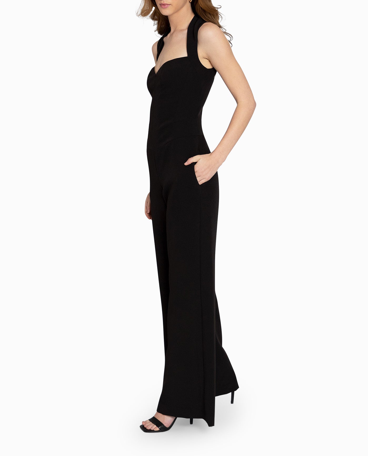 SIDE OF JUMPSUIT WITH HAND IN SIDE POCKET | BLACK